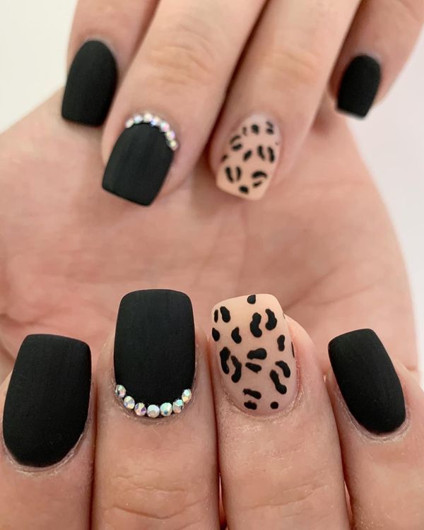 Matte black square nails with leopard-print and rhinestone accent nails