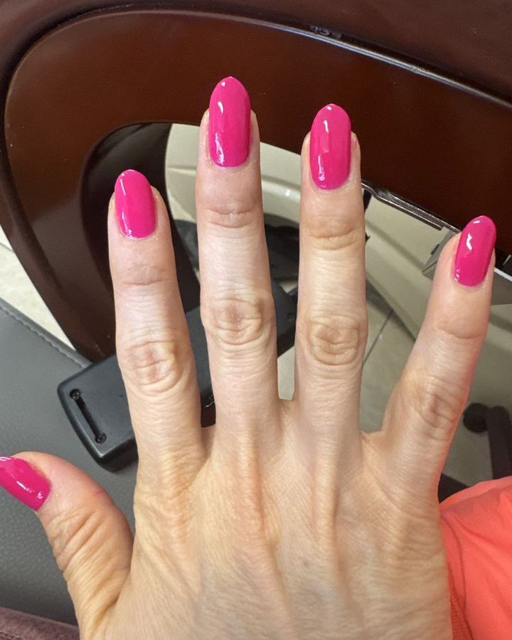 Bright pink almond-shape manicure