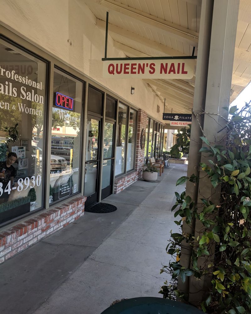 The Queen's Nails storefront under the covered walkway at Palos Verdes Mall, with the hanging Queen's Nail sign and an Open sign in the window